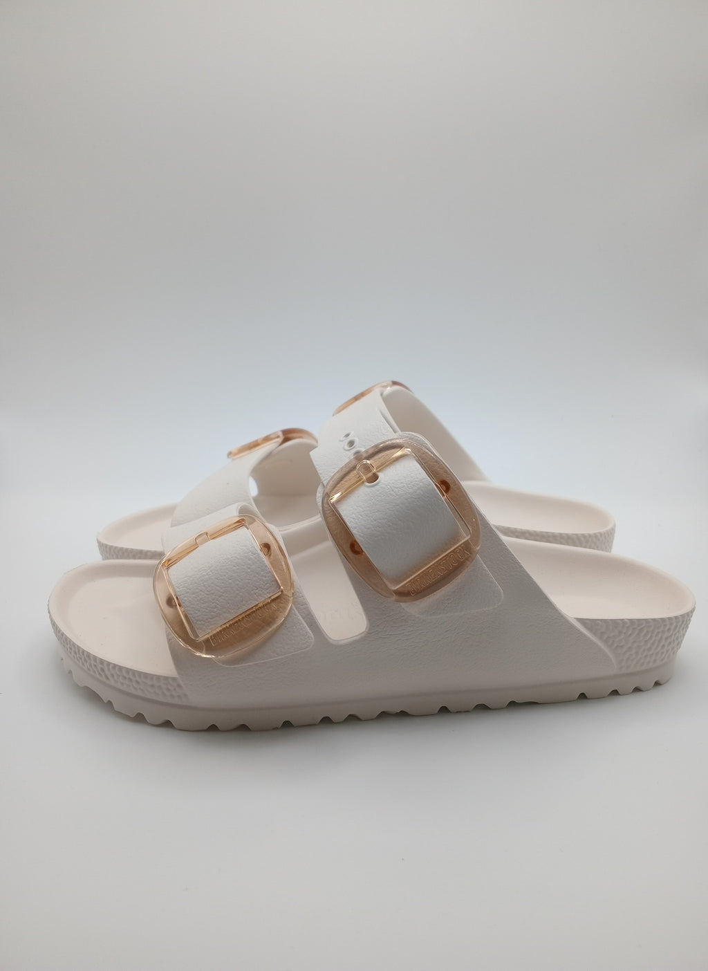 SANDÁLIA ARIZONA EVA BIRKENSTOCK OFF WHITE FIVELA CARAMELO PLÁSTICO BRANCO